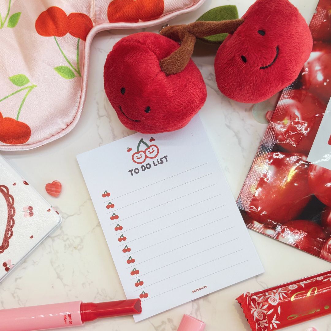 Red plush toy with a smiley face, &