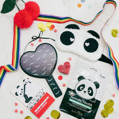 Collection of panda-themed products including a mask, stickers, and a pouch on a white background.